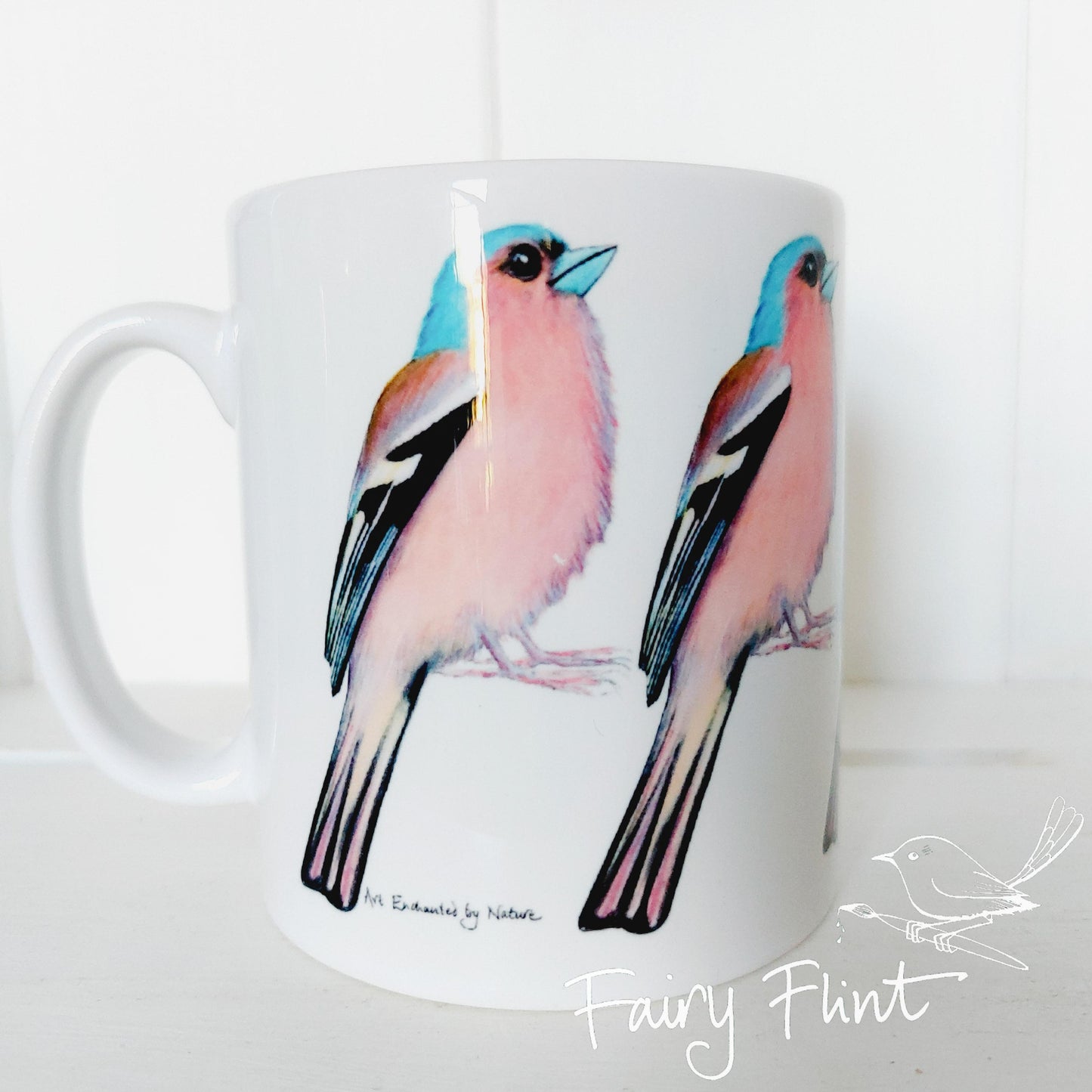 Ceramic mug with Chaffinch painting by Fairy Flint repeated round the mug, printed withy eco friendly inks