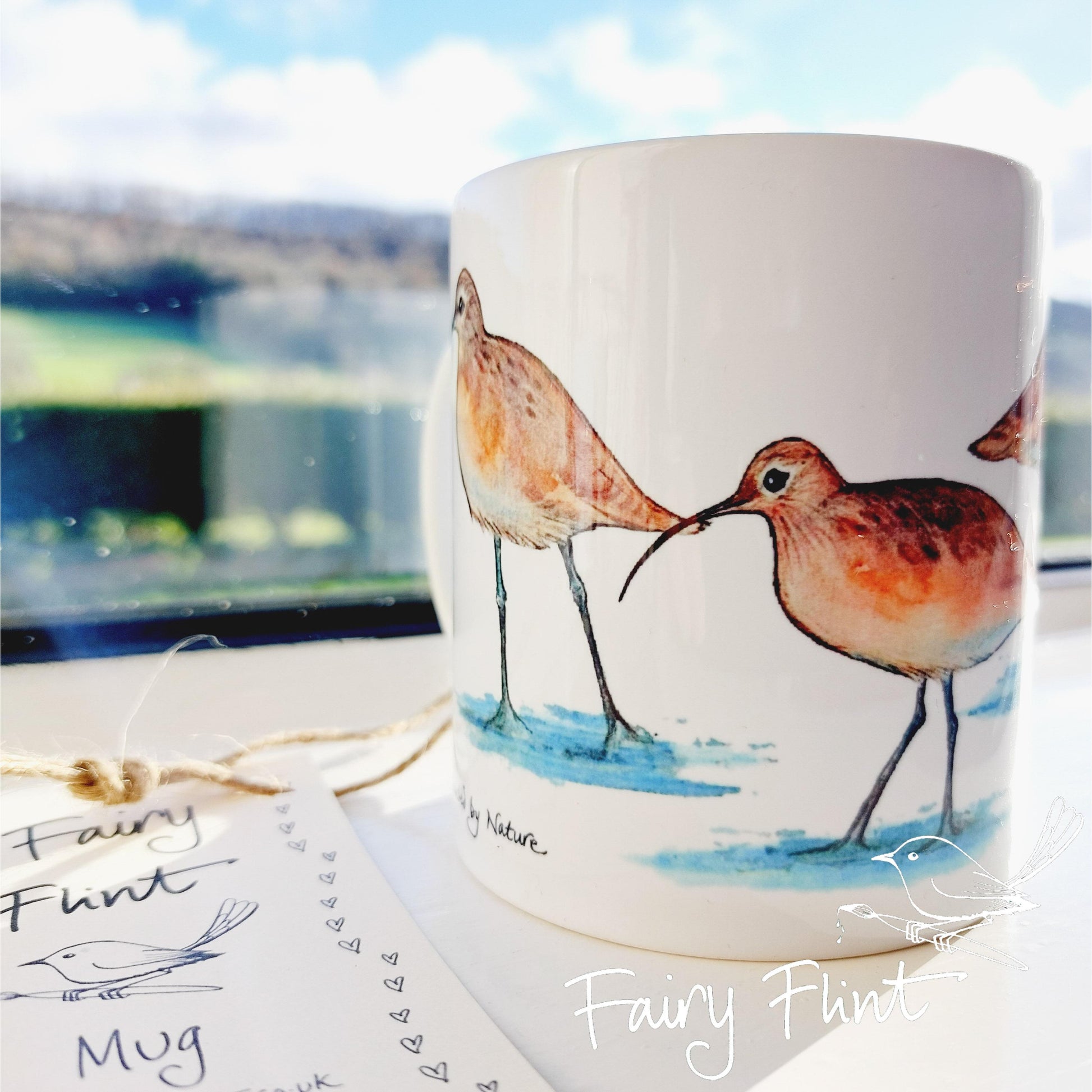 Ceramic mug with Curlew painting by Fairy Flint, printed withy eco friendly inks, photoshoot at Eaton Manor, Shropshire, Wenlock edge in the background