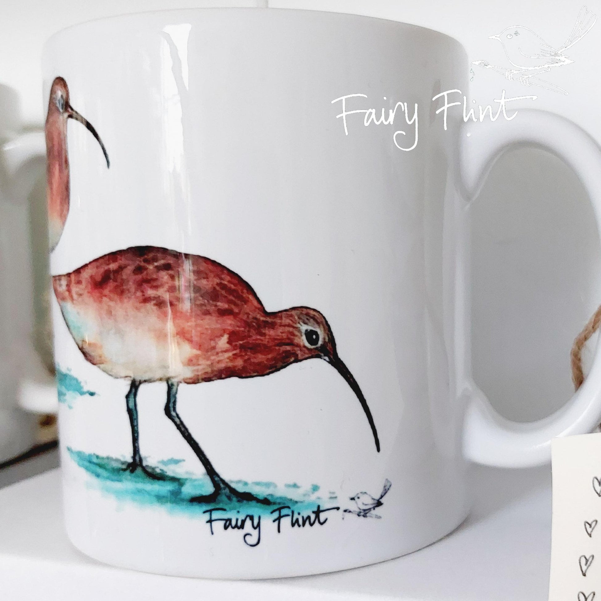 Ceramic mug with Curlew painting by Fairy Flint, printed withy eco friendly inks