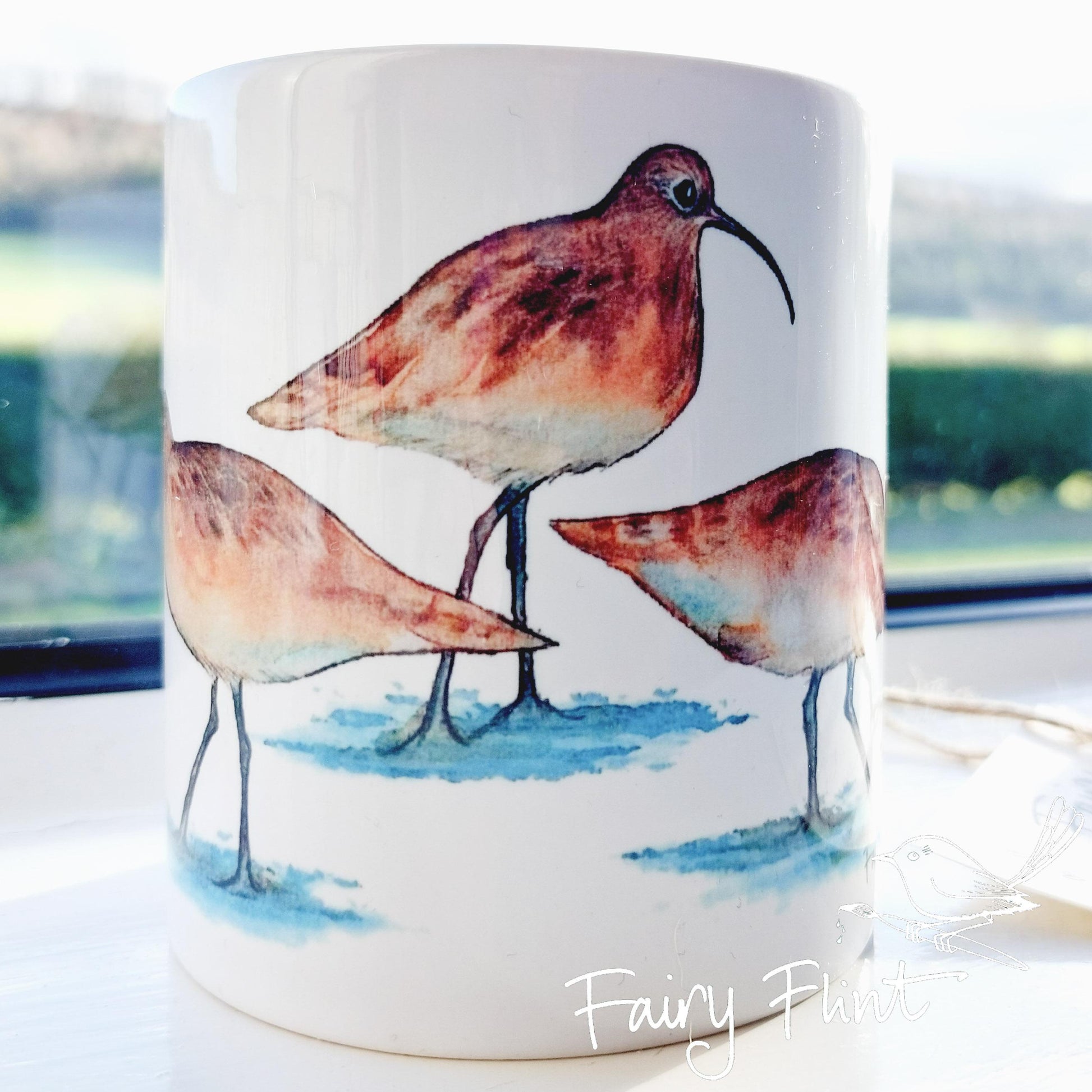 Ceramic mug with Curlew painting by Fairy Flint, printed withy eco friendly inks, photoshoot at Eaton Manor, Shropshire, Wenlock edge in the background