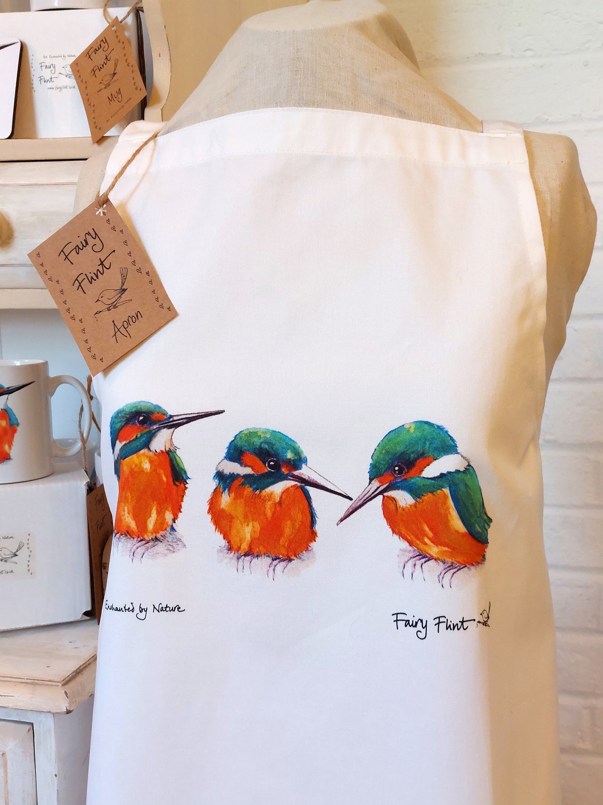 A trio of Young Kingfishers adorn this white organic cotton apron 