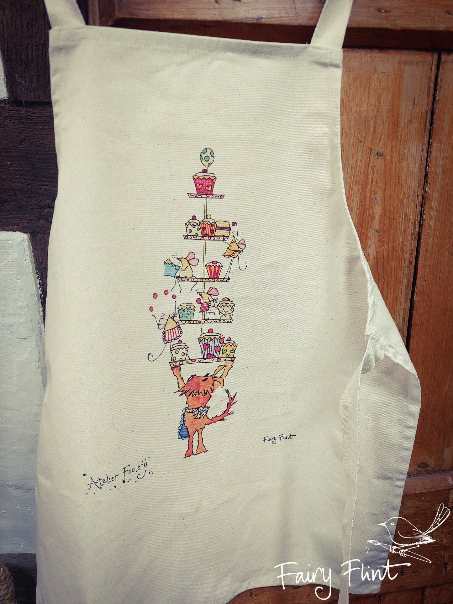 Children's apron with cartoon dog and mice having a fun cake tea by Fairy Flint