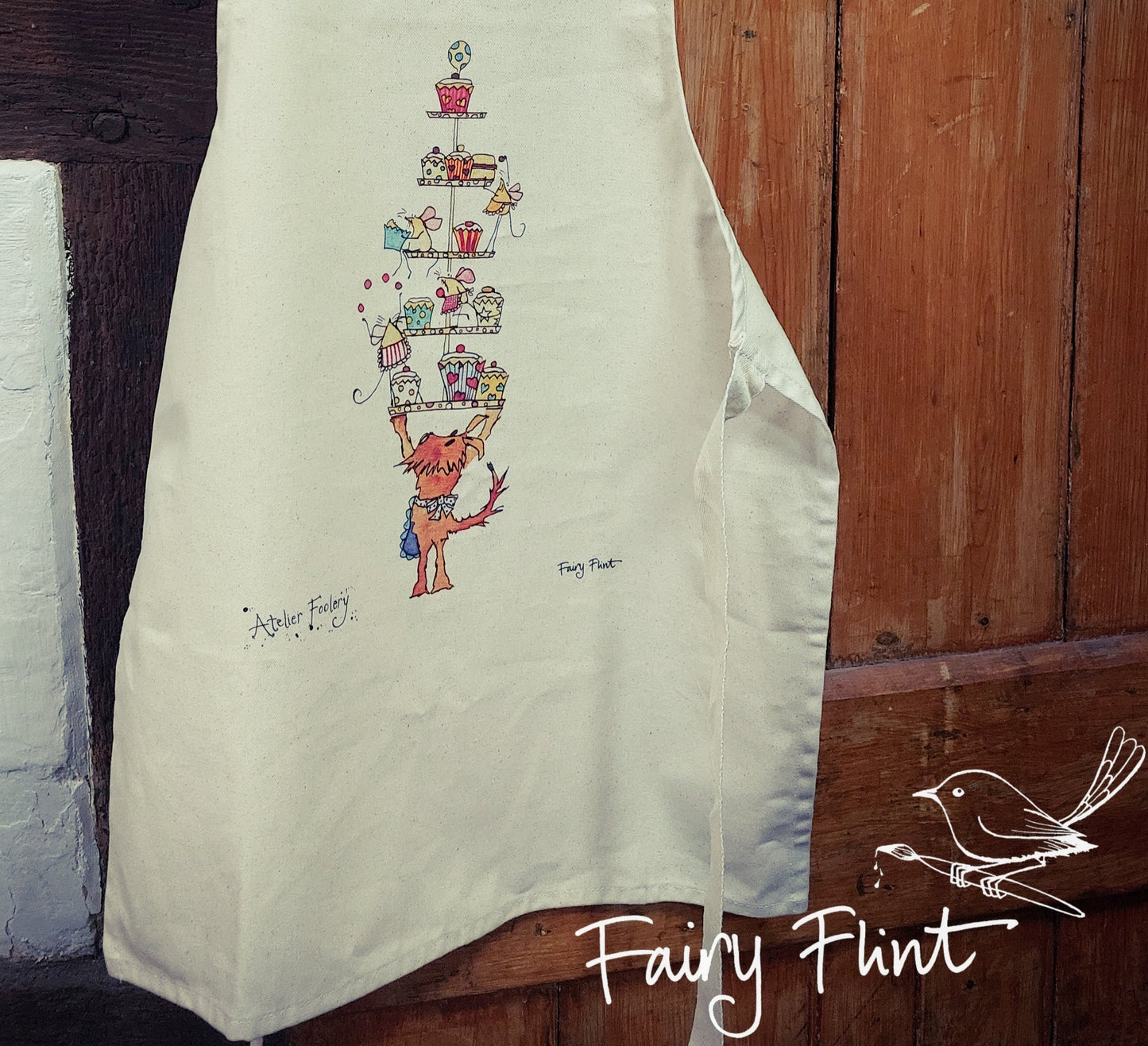 Children's apron with cartoon dog and mice having a fun cake tea by Fairy Flint