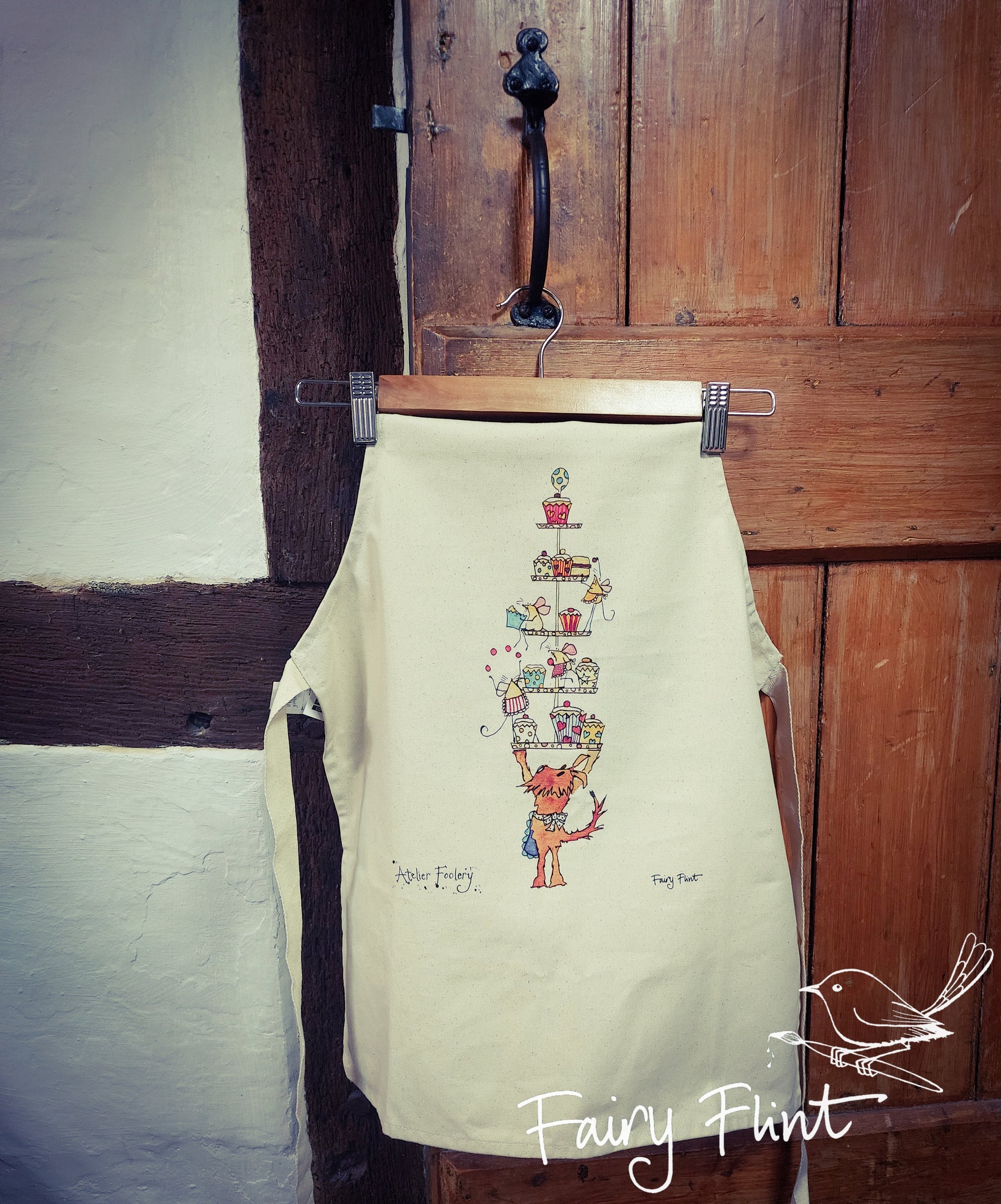 Children's apron with cartoon dog and mice having a fun cake tea by Fairy Flint