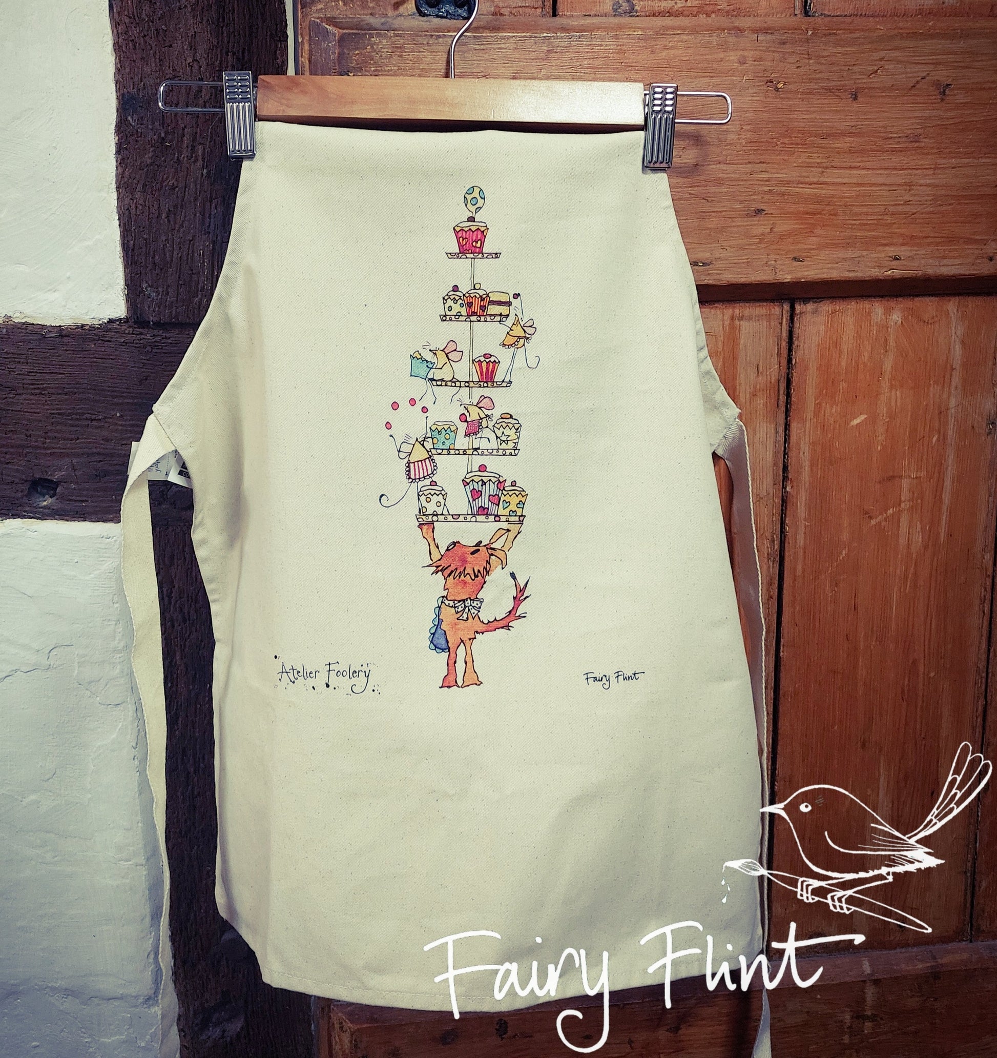 Children's apron with cartoon dog and mice having a fun cake tea by Fairy Flint