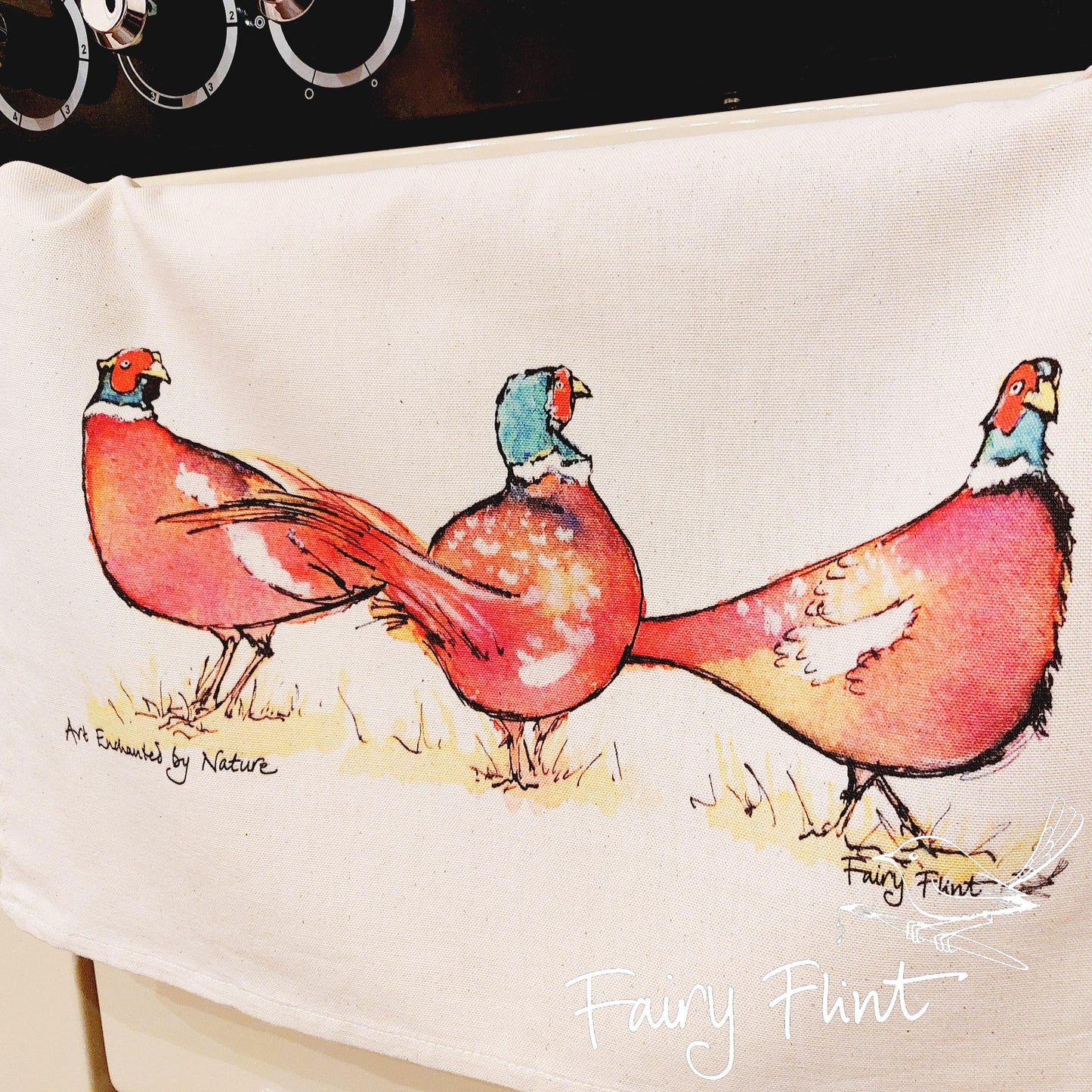 Tea towel with eco print Pheasant painting design by Fairy Flint photoshoot at Eaton Manor Shropshire, tea towel hanging on range cooker