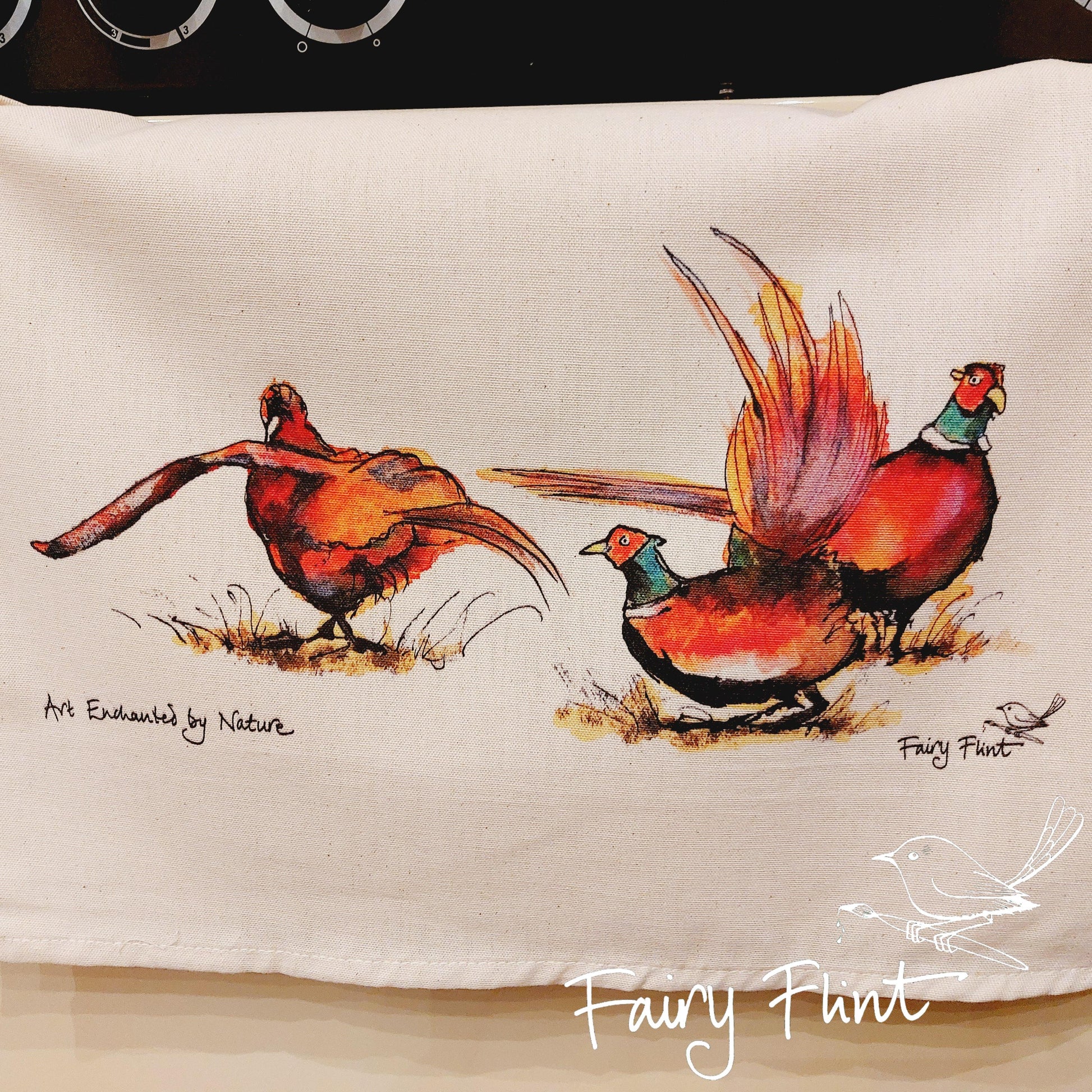 Tea towel with eco print Pheasant painting design by Fairy Flint photoshoot at Eaton Manor Shropshire, tea towel hanging on range cooker