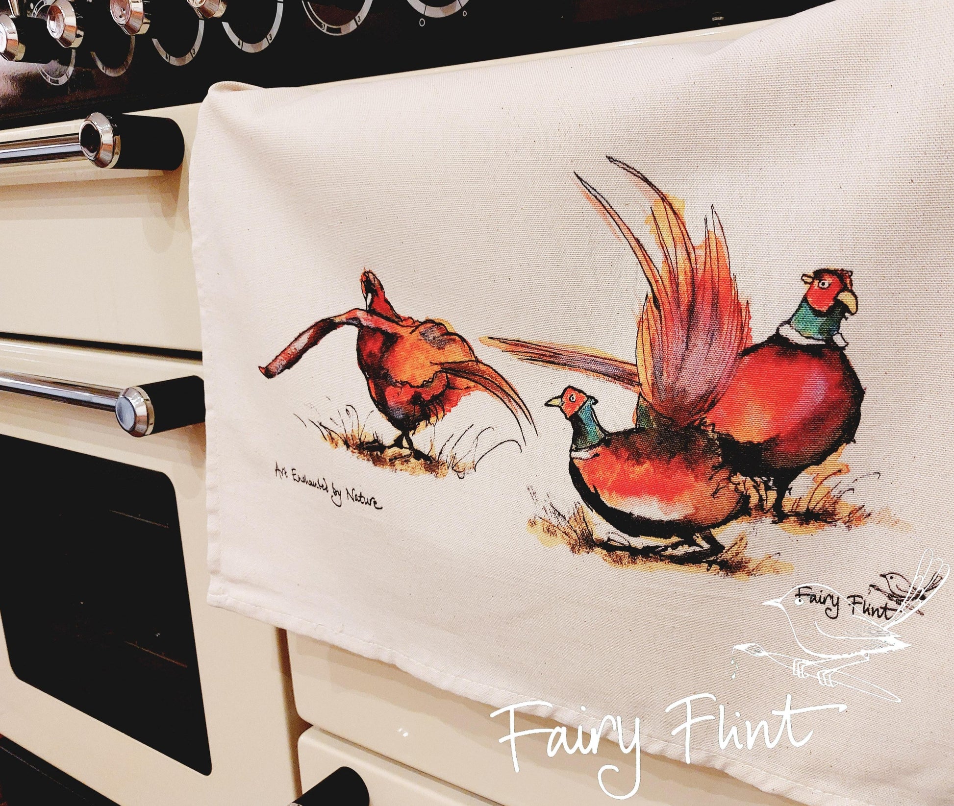 Tea towel with eco print Pheasant painting design by Fairy Flint photoshoot at Eaton Manor Shropshire, tea towel hanging on range cooker