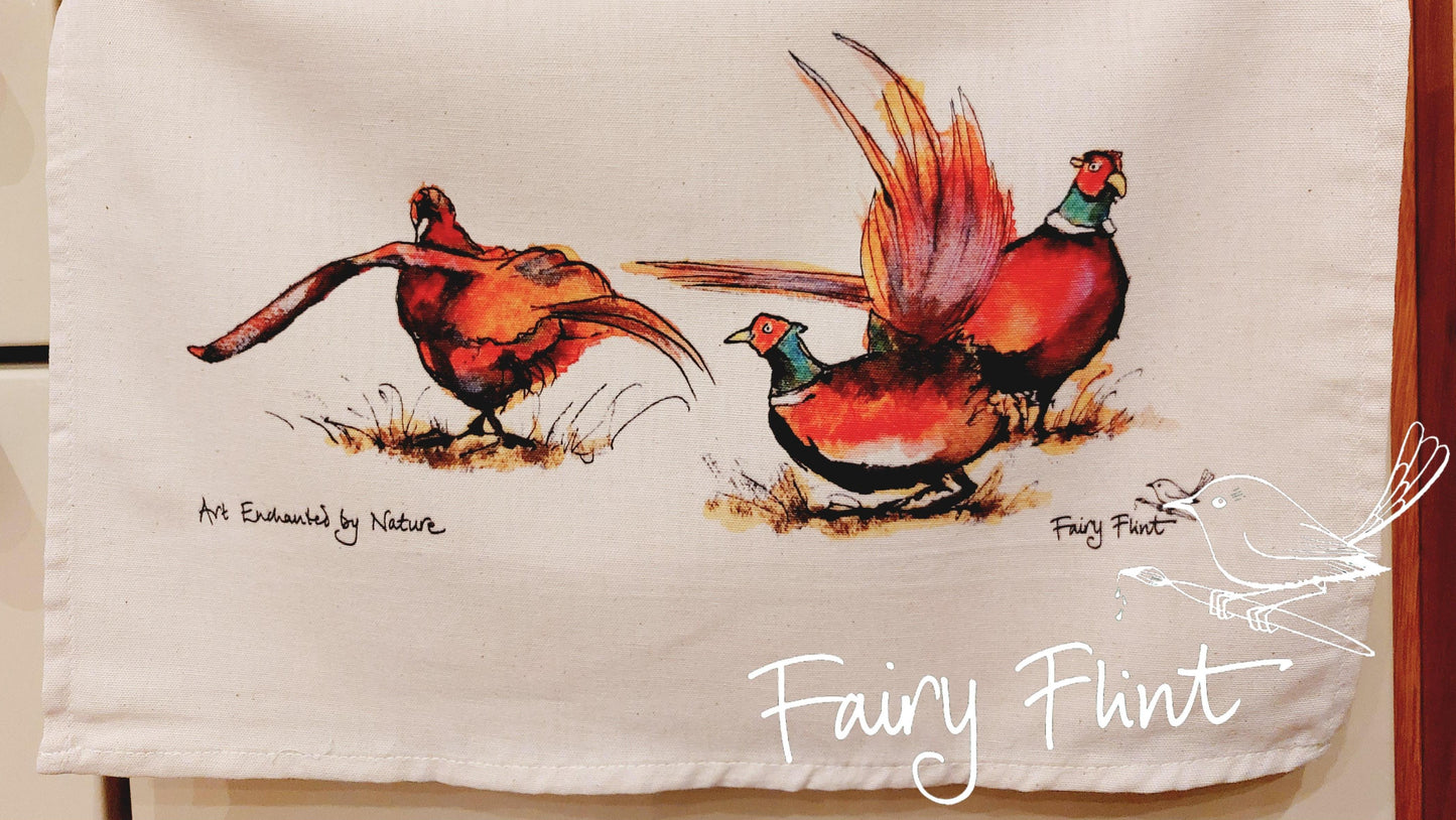 Tea towel with eco print Pheasant painting design by Fairy Flint photoshoot at Eaton Manor Shropshire, tea towel hanging on range cooker