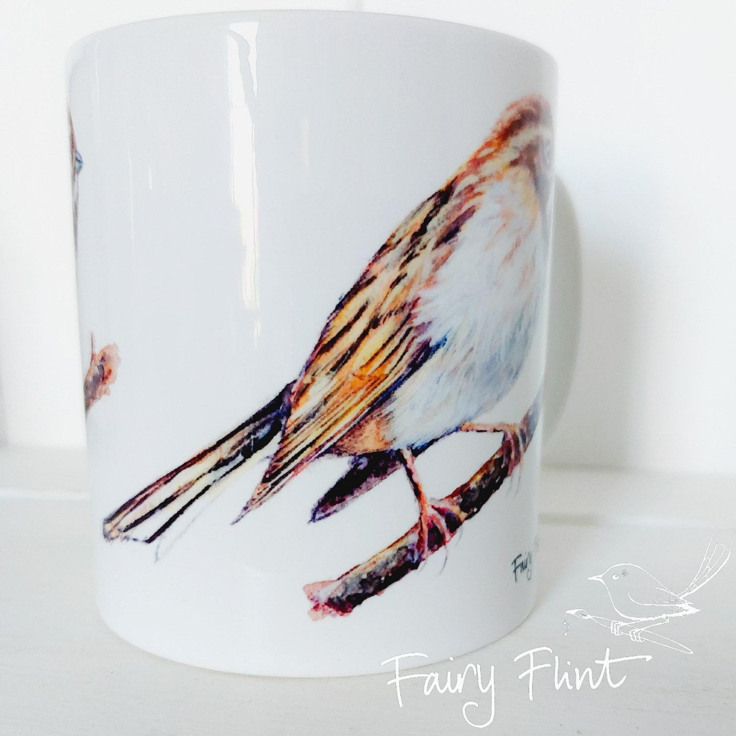 White mug with Reed Bunting painting 