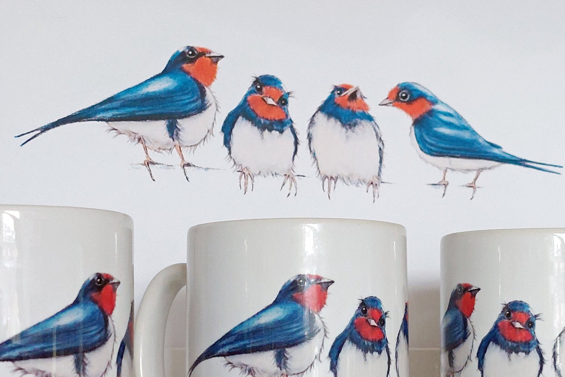 Mugs and a print feature 4 young swallows by Fairy Flint 