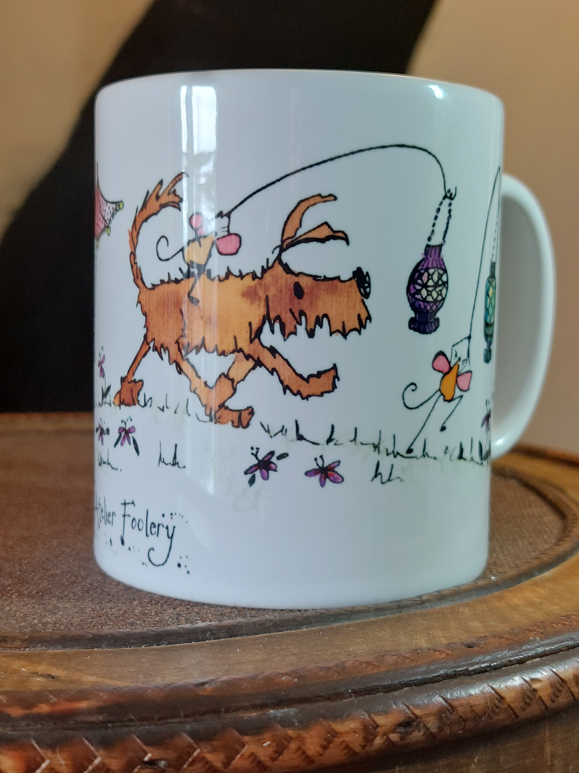 Ceramic mug with cartoon dog and mice having a fun Lantern Parade with Parasols by Fairy Flint at Atelier Foolery