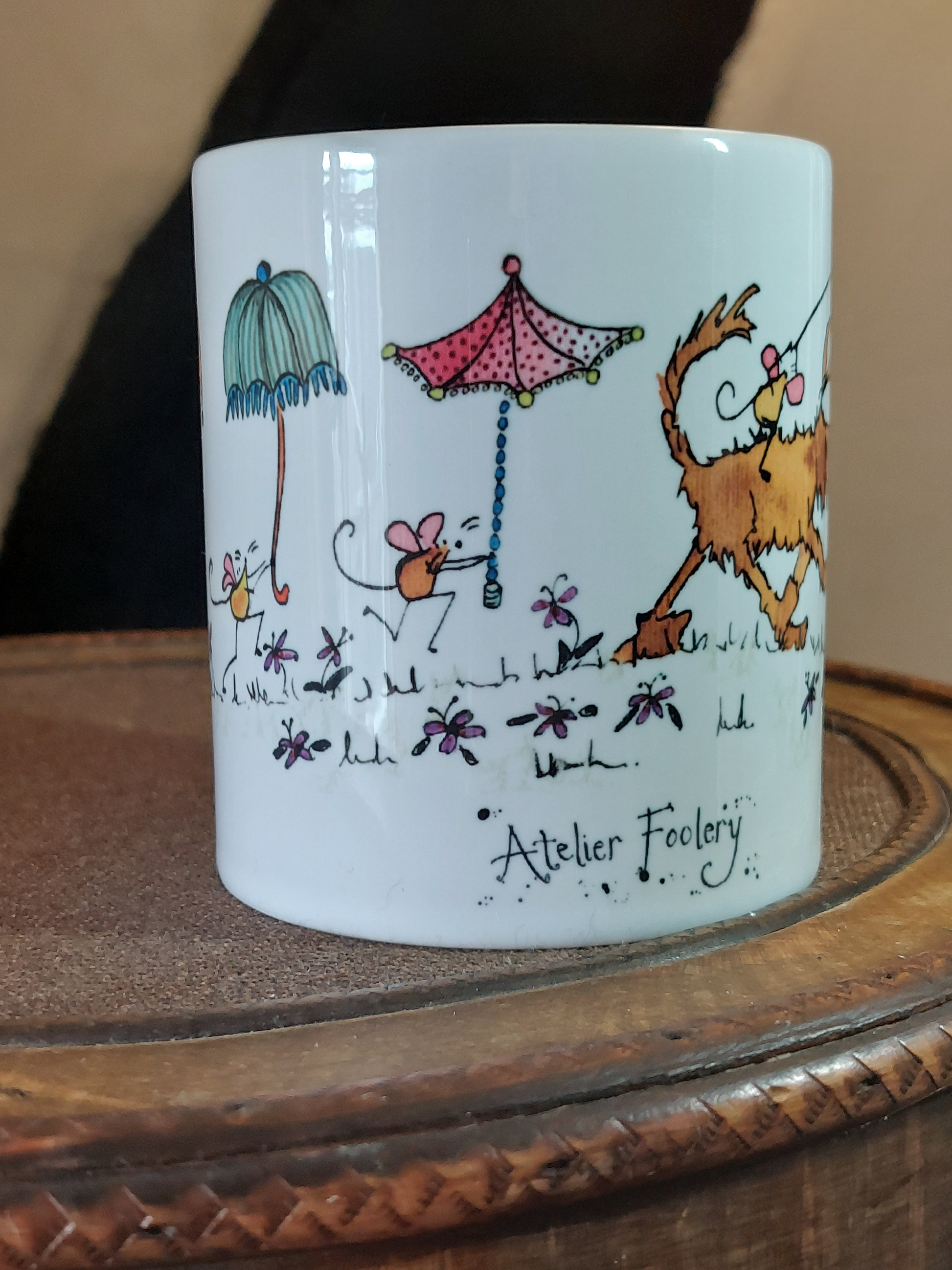 Ceramic mug with cartoon dog and mice having a fun Lantern Parade with Parasols by Fairy Flint at Atelier Foolery